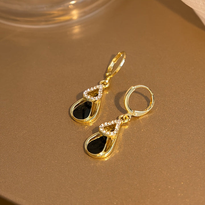 Ralia | Doppelte Tropfenohrringe mit durchbrochenem Design und elegantem Finish